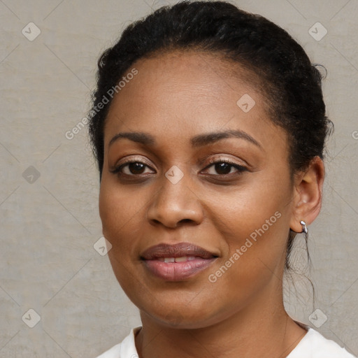 Joyful black young-adult female with short  brown hair and brown eyes