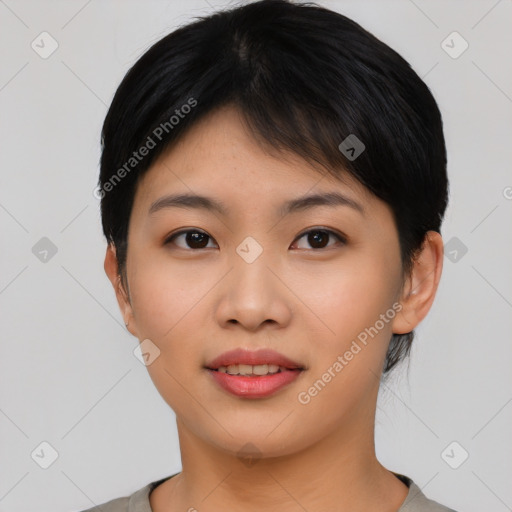 Joyful asian young-adult female with short  black hair and brown eyes