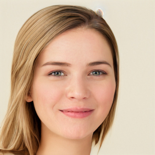 Joyful white young-adult female with long  brown hair and blue eyes