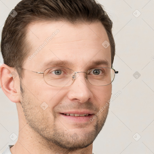 Joyful white adult male with short  brown hair and grey eyes