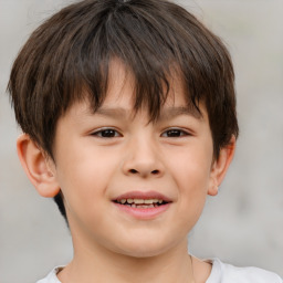 Joyful white child male with short  brown hair and brown eyes