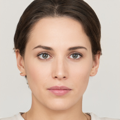 Neutral white young-adult female with short  brown hair and brown eyes