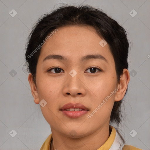 Joyful asian young-adult female with short  brown hair and brown eyes