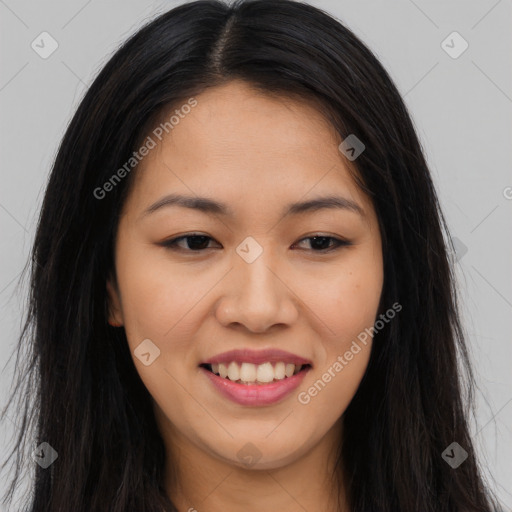 Joyful asian young-adult female with long  brown hair and brown eyes