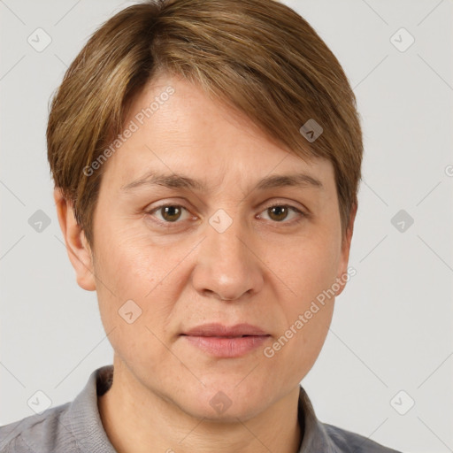 Joyful white adult female with short  brown hair and grey eyes