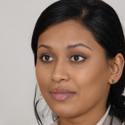 Joyful asian young-adult female with medium  black hair and brown eyes