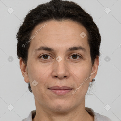 Joyful white adult female with short  brown hair and brown eyes