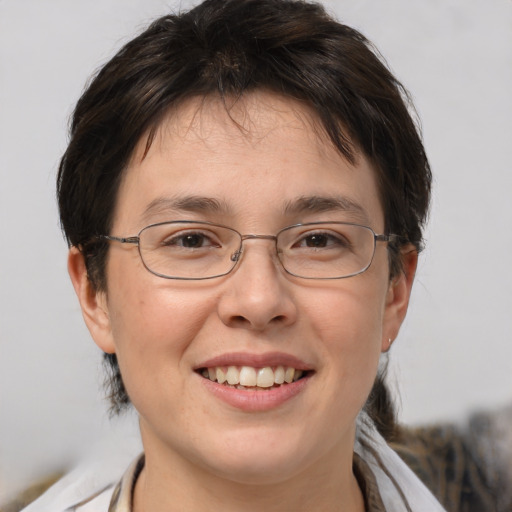 Joyful white adult female with medium  brown hair and brown eyes