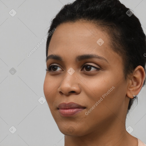 Joyful latino young-adult female with short  black hair and brown eyes