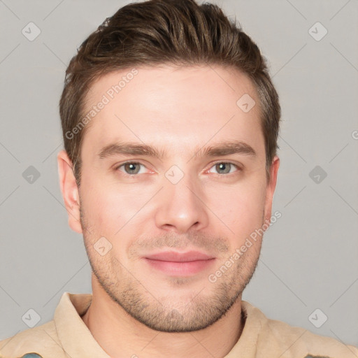 Joyful white young-adult male with short  brown hair and grey eyes