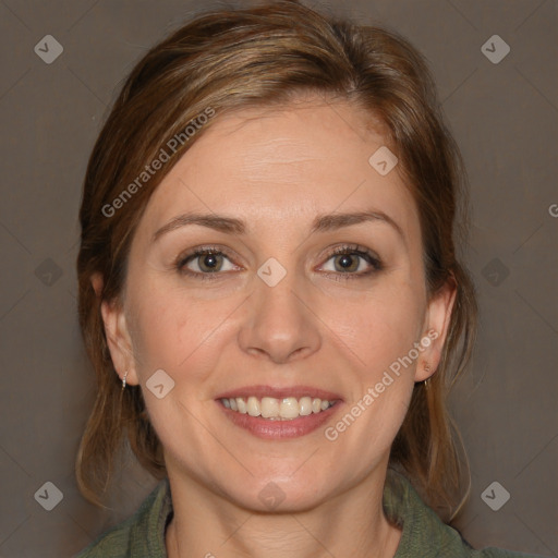 Joyful white young-adult female with medium  brown hair and blue eyes