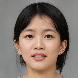 Joyful asian young-adult female with medium  black hair and brown eyes