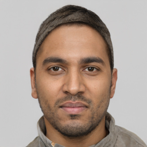 Neutral latino young-adult male with short  black hair and brown eyes