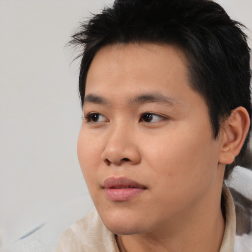 Neutral asian young-adult male with short  black hair and brown eyes