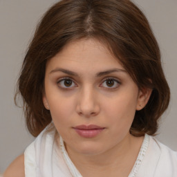 Neutral white young-adult female with medium  brown hair and brown eyes