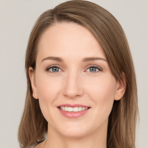 Joyful white young-adult female with long  brown hair and grey eyes