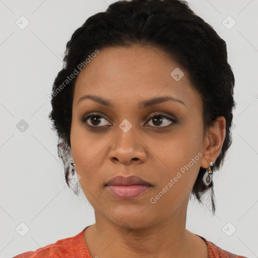 Joyful black young-adult female with medium  brown hair and brown eyes