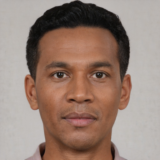 Neutral black young-adult male with short  black hair and brown eyes