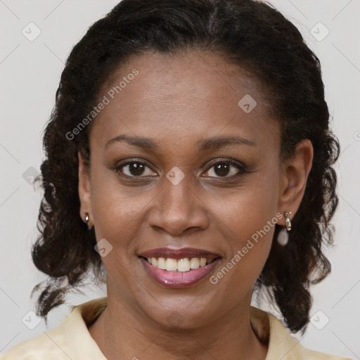 Joyful black young-adult female with medium  brown hair and brown eyes