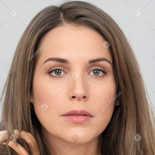 Neutral white young-adult female with long  brown hair and brown eyes