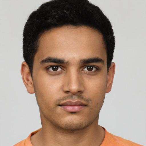 Neutral latino young-adult male with short  black hair and brown eyes
