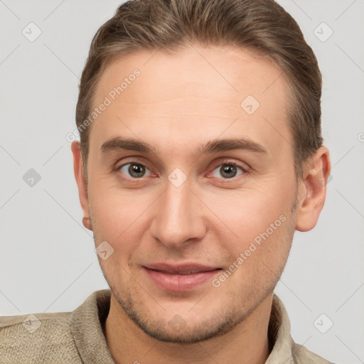 Joyful white young-adult male with short  brown hair and brown eyes