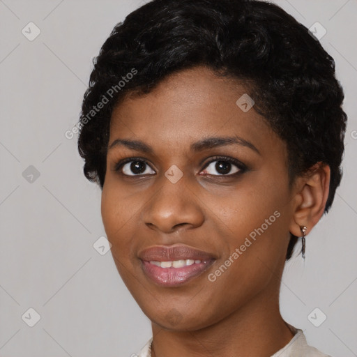 Joyful black young-adult female with short  black hair and brown eyes