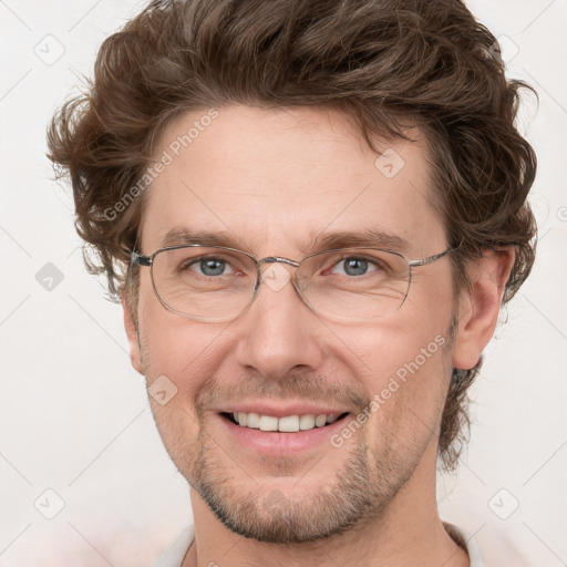 Joyful white adult male with short  brown hair and grey eyes