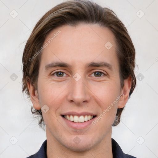 Joyful white young-adult male with medium  brown hair and brown eyes