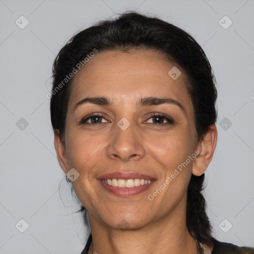 Joyful white adult female with medium  brown hair and brown eyes