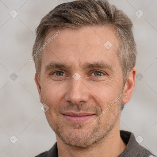 Joyful white adult male with short  brown hair and grey eyes