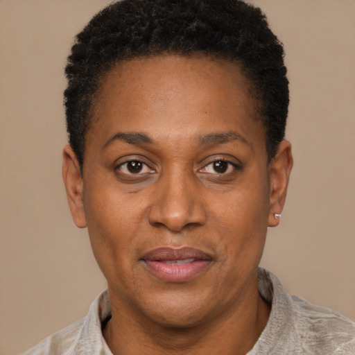Joyful latino adult female with short  black hair and brown eyes