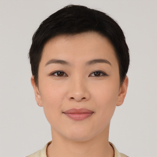 Joyful asian young-adult female with short  black hair and brown eyes