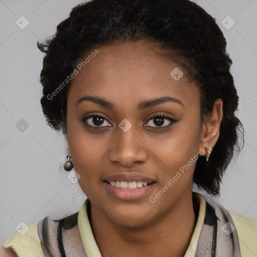 Joyful black young-adult female with long  black hair and brown eyes