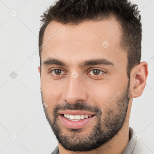 Joyful white young-adult male with short  brown hair and brown eyes