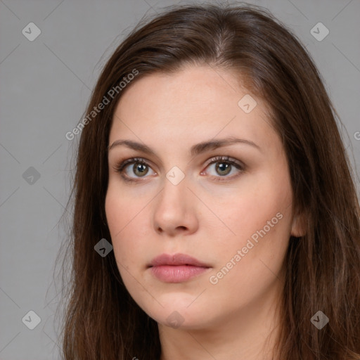 Neutral white young-adult female with long  brown hair and brown eyes