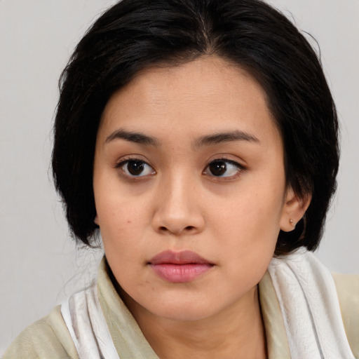 Neutral asian young-adult female with medium  black hair and brown eyes