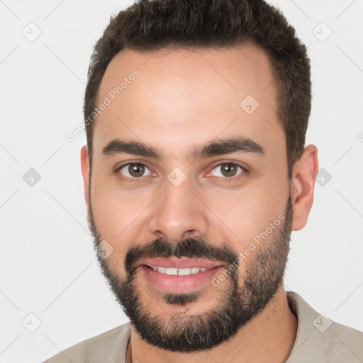 Joyful white young-adult male with short  brown hair and brown eyes