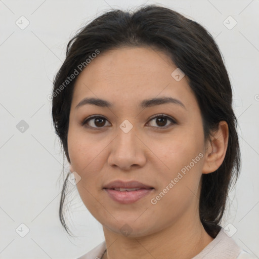 Joyful asian young-adult female with medium  brown hair and brown eyes