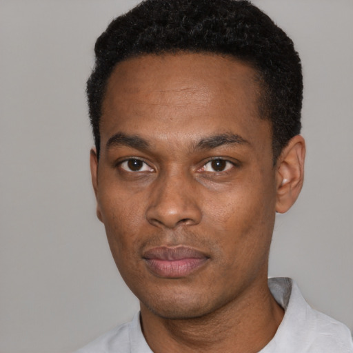 Neutral black young-adult male with short  black hair and brown eyes