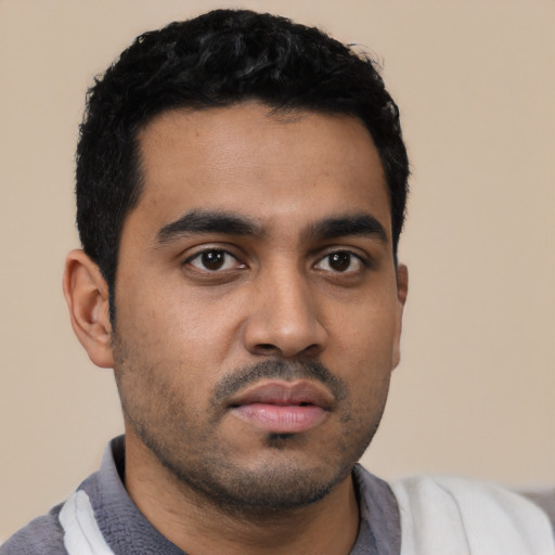 Neutral latino young-adult male with short  black hair and brown eyes