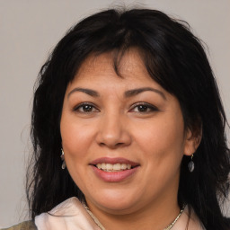 Joyful white adult female with medium  brown hair and brown eyes