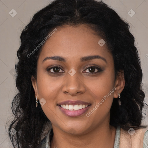 Joyful black young-adult female with long  brown hair and brown eyes