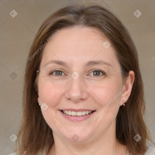 Joyful white adult female with medium  brown hair and grey eyes