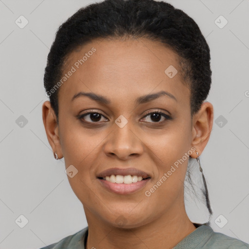 Joyful black young-adult female with short  black hair and brown eyes