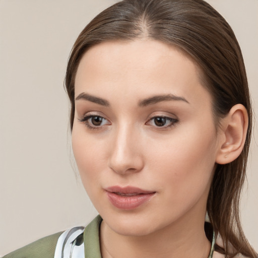 Neutral white young-adult female with long  brown hair and brown eyes