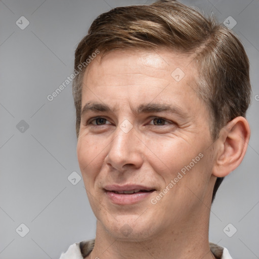 Joyful white adult male with short  brown hair and brown eyes