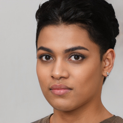 Neutral latino young-adult female with short  black hair and brown eyes