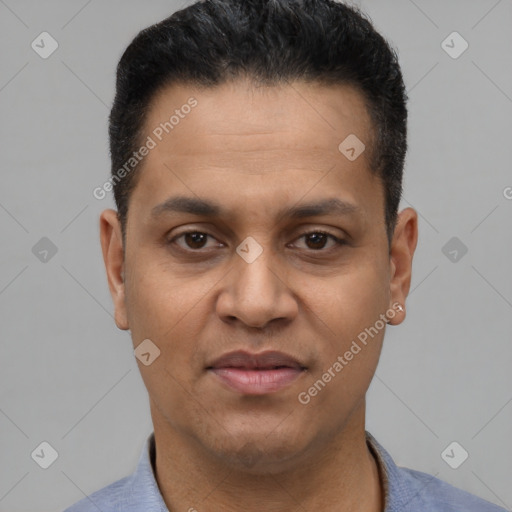 Joyful latino young-adult male with short  brown hair and brown eyes
