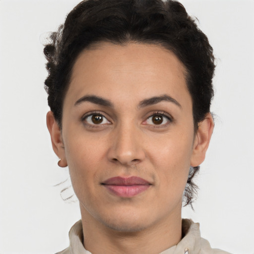 Joyful white young-adult female with short  black hair and brown eyes